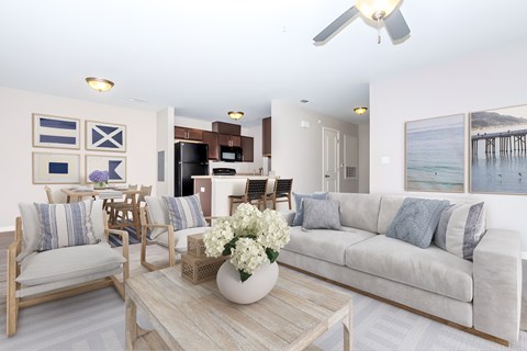 A living room with a couch, chairs, and a coffee table.